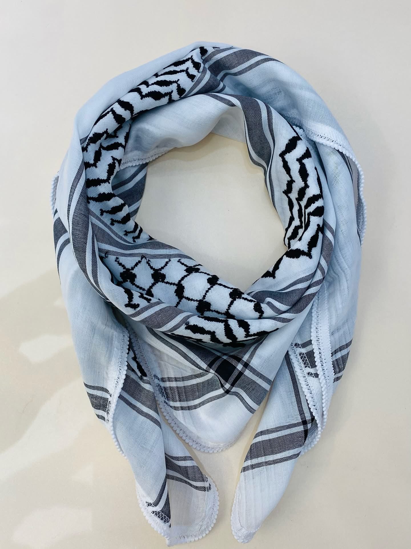 Hand-embroidered scarves ( Kufiya )
